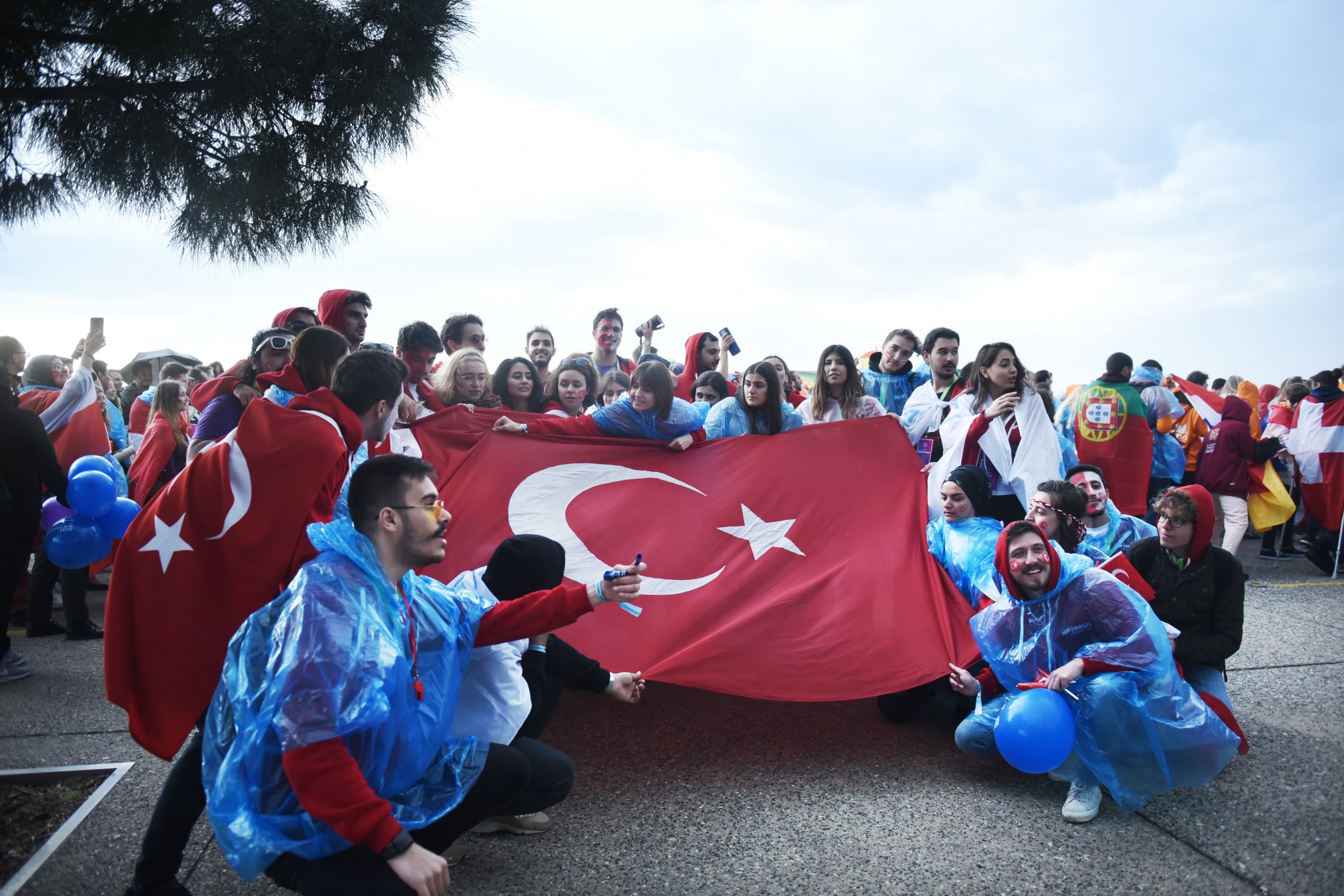 Students celebrating with Turkish flag